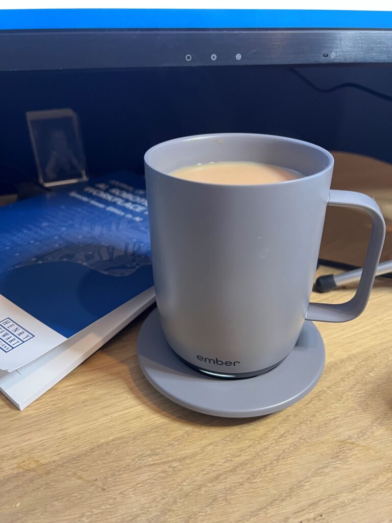 Grey ember mug full of tea on a desk